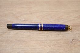 A Parker Duofold Lady button fill fountain pen in Lapis Lazuli Blue with three narrow bands to