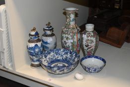 Two Chinese famille rose porcelain vases (both with damages and repairs) sold along with a pair of
