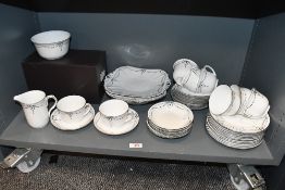 A quantity of early 20th-century Shelley china 'Black bow ribbon swag', featuring cups, saucers,