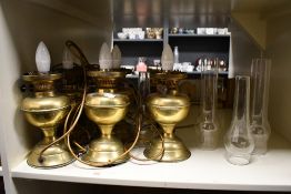 A set of six vintage brass electric table lamps, each of matching oil lamp design with faux