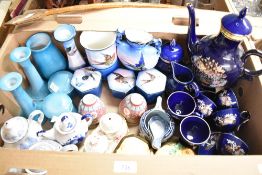 Two vintage dressing table sets both of which include vases, candlesticks and trinket boxes, a