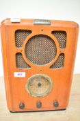 A vintage Bush R701 FM/MW analogue radio with a wooden case, marked to front plaque, 34cm x 24.