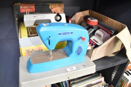 This lot features three mid-20th-century toys manufactured in England. The first is a Vulcan Classic