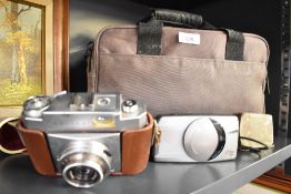Two Cameras. A Zeiss Ikon Contina and a Canon Z70W in a soft camera bag