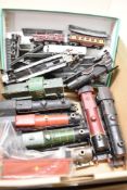 A collection of vintage model railway locomotives, rolling stock, and track components, primarily