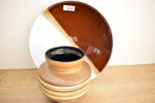 A small mid-20th-century West German ceramic vase, featuring a moulded multicoloured ribbed pattern,