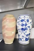 A large late 20th-century Chinese-style blue and white floor vase, featuring peach tree motif