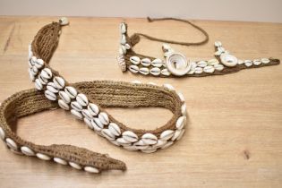 Of ethnographic interest, two early to mid 20th-century Papua New Guinea hand woven cowrie shell
