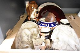 A vintage 'Its a Dogs Life' musical decanter, a Toby Jug novelty tea pot and two similar jugs, a