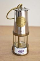 A miniature 20th-century brass and stainless steel Eccles Protector miners lamp after Protector Lamp