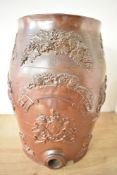 A Victorian salt-glazed stoneware spirit barrel, of traditional form, moulded in relief with the