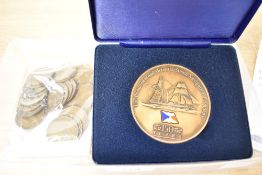 A bronze commemprative medallion celebrating 150 years of P&O Shipping sold along with 25 George V