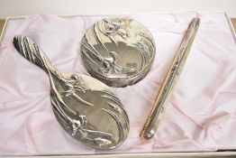 A mid to late 20th-century Anais Anais Cacheral silver-plated vanity dressing table set, featuring