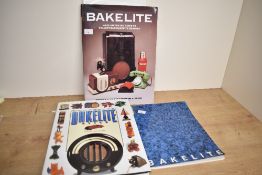 Three vintage Bakelite books and a French bakelite poster, all marked, (4), condition consistent