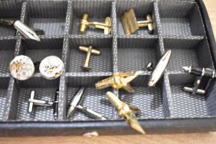 A faux leather jewellery box, containing an assortment of cufflinks, including novelty pen
