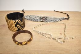 Of ethnographic interest, two pieces of 20th-century Papua New Guinea tribal shell adornment, to