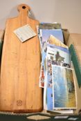 A JK Adams Co. Artisan bread board sold along with a selection of assorted vintage postcards.