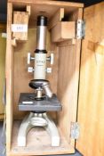 A mid to late 20th-century Japanese Opax microscope, No. 6071, accompanied by wooden storage box,