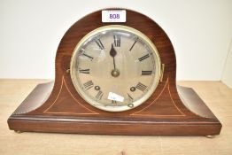 An Edwardian stary inlaid mahogany mantel clock of arched form, featuring a gilt face of Roman