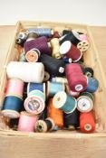 A basket of vintage sewing threads.