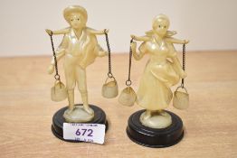 Two vintage Italian-style ivory-coloured plastic figurines, depicting a young country boy and