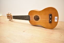 A modern ukulele, model Herald HUK15N, by John Hornby Skewes