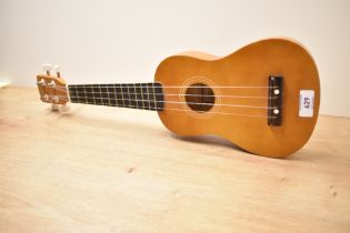 A modern ukulele, model Herald HUK15N, by John Hornby Skewes