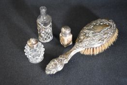 An Edwardian silver mounted hair brush, having Art Nouveau decoration, marks for Birmingham 1909,