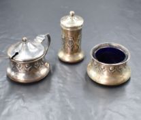 An Edwardian silver three piece condiment set, comprising salt, mustard and pepper, having