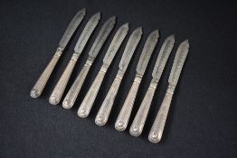 A Victorian wooden canteen, containing eight silver handled thread and shell pattern knives, with