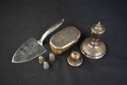 A George VI silver candlestick, of traditional form, along with a silver mounted clothes brush,