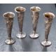 A group of four Victorian and Edwardian silver vases, of fluted form having embossed floral and - Image 1 of 2