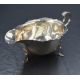 A George V silver sauce boat, having a Chippendale style rim with a narrow spout opposed by a scroll - Image 1 of 2