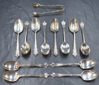 A cased set of twelve Edwardian silver Albany pattern teaspoons with sugar tongs, marks for