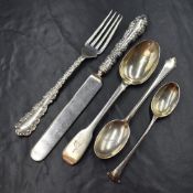 An American silver Christening set, comprising knife and fork with decorative scroll handles, having