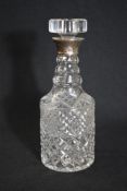 An Elizabeth II silver mounted moulded glass decanter, of cylindrical form having a silver mounted