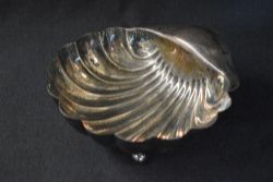 An Edwardian silver shell motif bowl, raised on three ball feet, marks for Sheffield 1904, maker