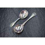 Two Georg Jensen silver Lily of the Valley pattern spoons, marks for C.1910-1925 and C.1933-1944,