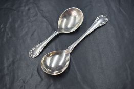 Two Georg Jensen silver Lily of the Valley pattern spoons, marks for C.1910-1925 and C.1933-1944,
