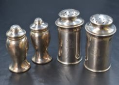 A cased pair of George V silver pepperettes, of baluster form, marks for Birmingham 1919, rubbed
