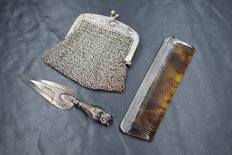 An Edwardian silver novelty bookmark, having an owl to the terminal, along with a continental silver