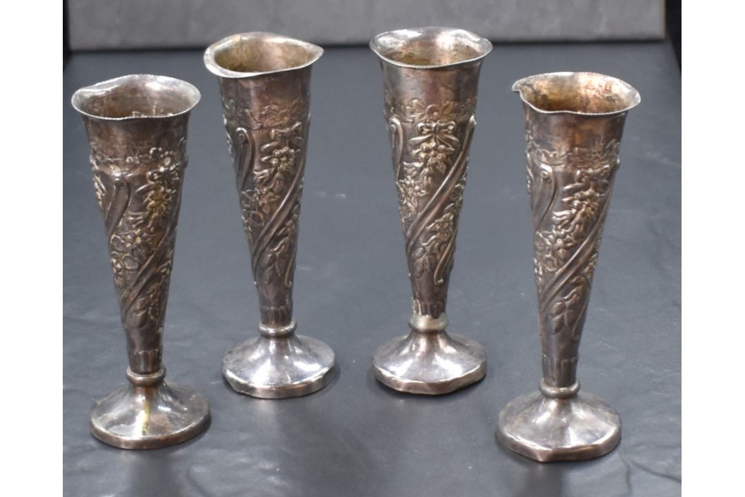 A group of four Victorian and Edwardian silver vases, of fluted form having embossed floral and - Image 2 of 2