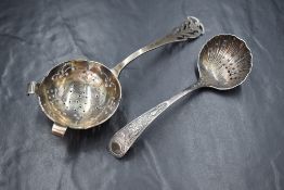 A Victorian silver sugar sifter, of traditional form having scroll decoration to terminal, along