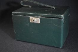 A late Victorian travel vanity set, having silver topped glass powder pots and scent bottles,