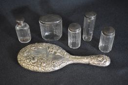 A group of five silver topped glass vanity wares, having engraved decoration, marks for London 1878,