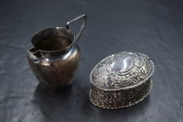 A Victorian silver cream jug, of traditional form having a narrow spout opposed by an angular