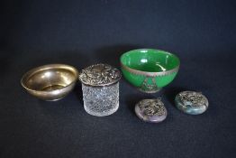 A Victorian silver topped glass powder pot, having scroll and diaper decoration with rubbed