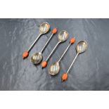 A cased group of five George VI silver coffee bean spoons, having orange 'beans', marks for