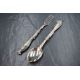 A cased Victorian silver christening set, comprising a spoon and fork with ornate scroll work to the - Image 1 of 2
