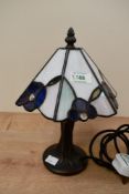A small 20th-century Tiffany-style table lamp, to feature a iridescent floral shade with a tree-like